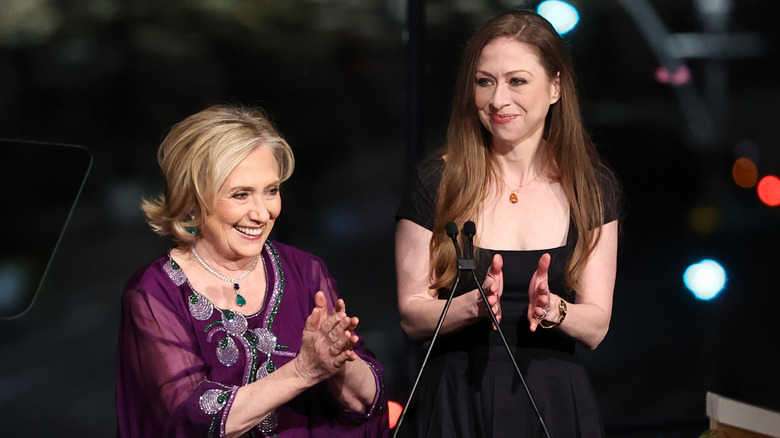 Chelsea and Hillary Clinton clapping