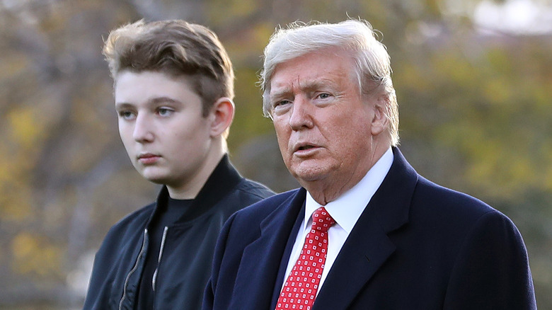 Donald and Barron Trump walking outdoors