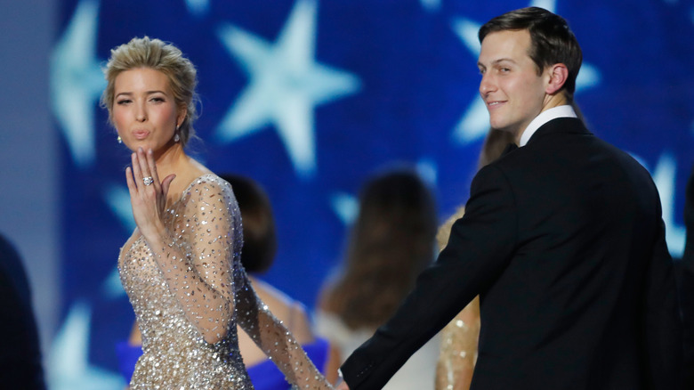 Ivanka Trump blows a kiss while Jared Kushner looks on