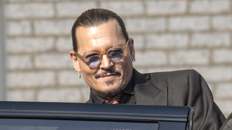 Johnny Depp getting into a car during Depp vs. Heard trial.