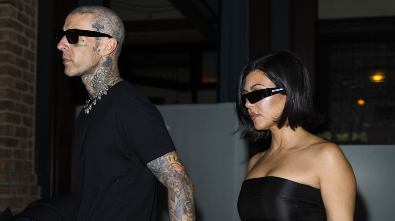 Kourtney Kardashian and Travis Barker at event