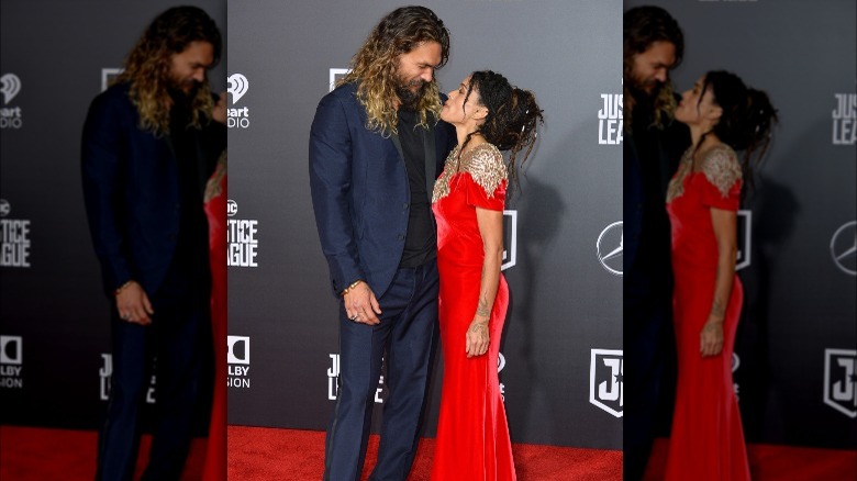 Jason Momoa and Lisa Bonet gazing at each other on the red carpet