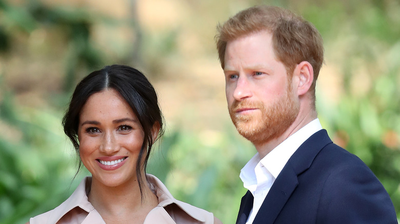 Meghan and Harry smiling