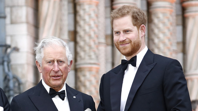 Prince Charles and Prince Harry wearing tuxedos. 