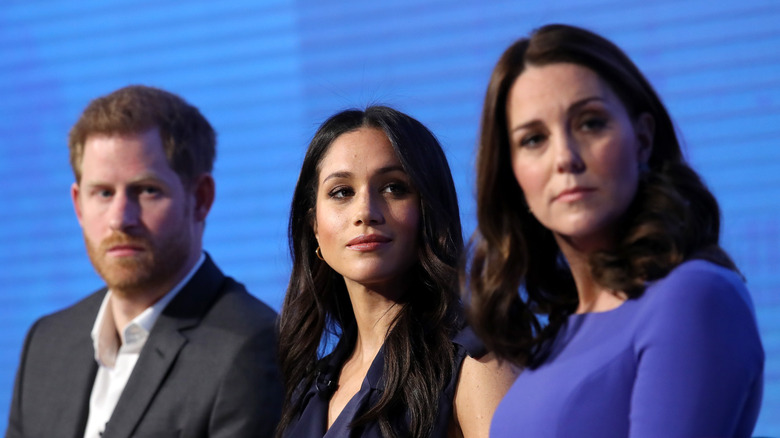 Prince Harry and Meghan Markle with Kate Middleton. 