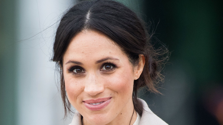 Meghan Markle smiles for photographers 