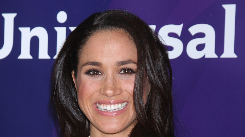 Meghan Markle smiles on the red carpet