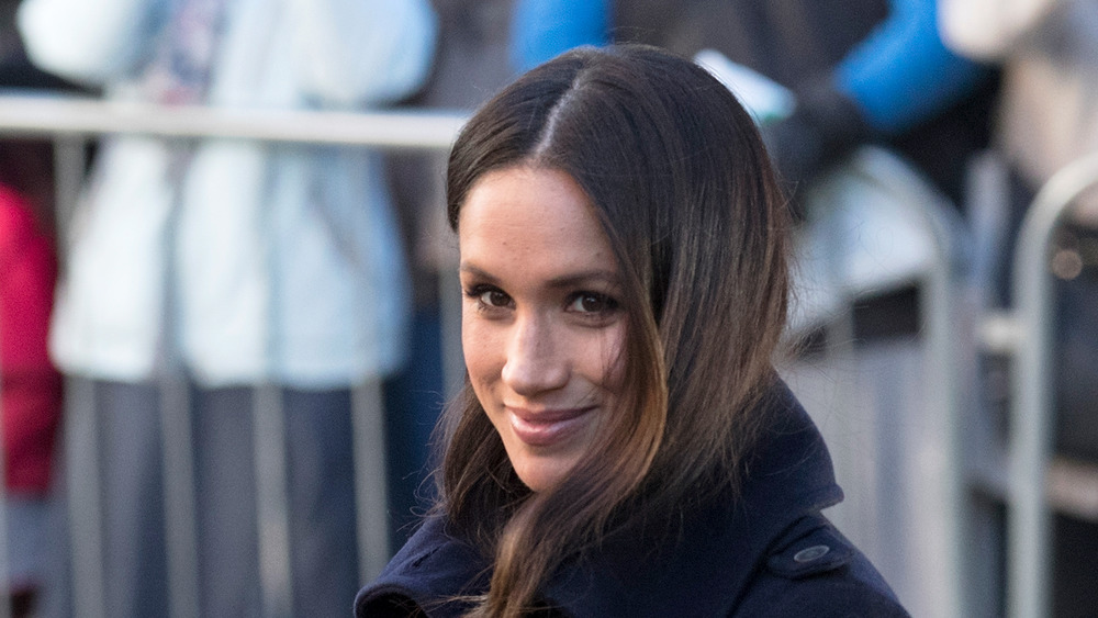 Meghan Markle smiling in a photo