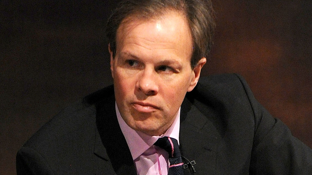 Tom Bradby wears a purple shirt and tie