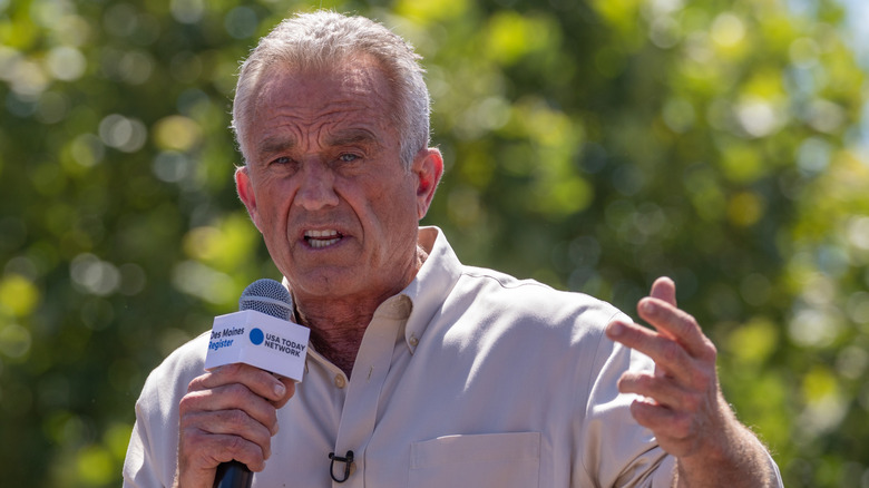 RFK Jr. speaking into a microphone.