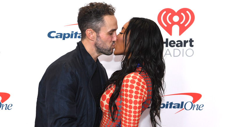 Tayshia Adams and Zac Clark sharing a kiss