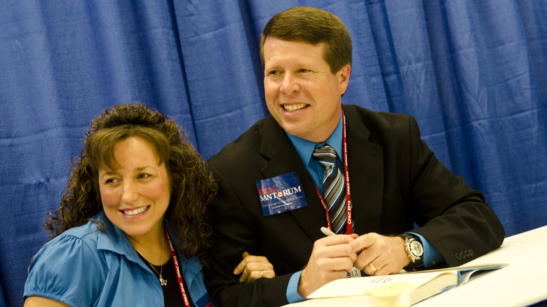 Jim Bob and Michelle Duggar smiling at a book signing