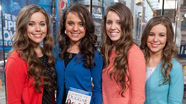 The Duggar sisters pose at an event