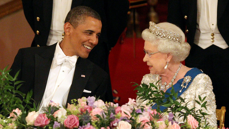 Barack Obama smiles at Queen Elizabeth