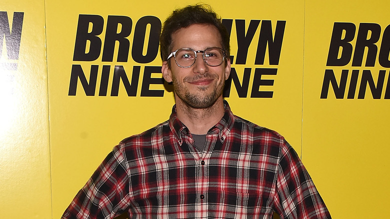 Andy Samberg poses at an event