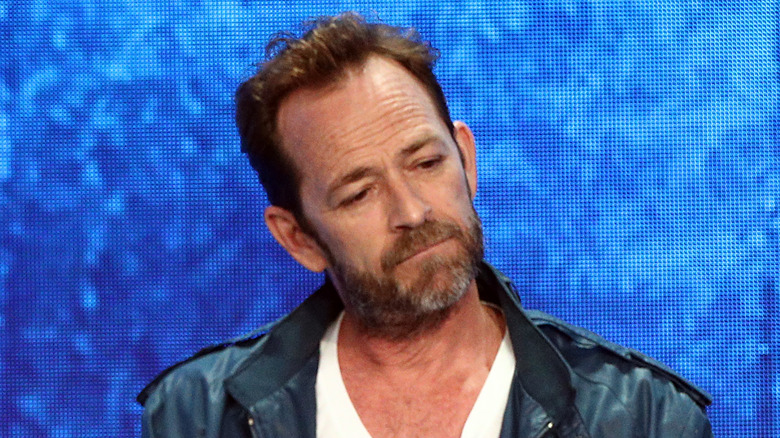 Luke Perry onstage at an event