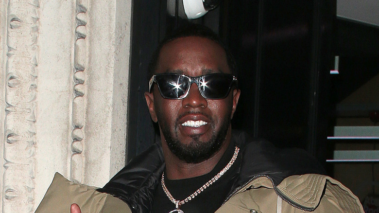 Sean "Diddy" Combs wearing dark sunglasses and a thick chain