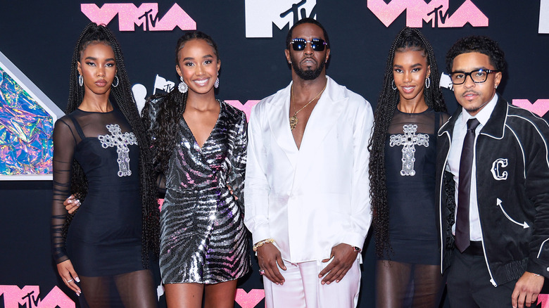 Diddy and his four kids posing at the 2023 VMAs