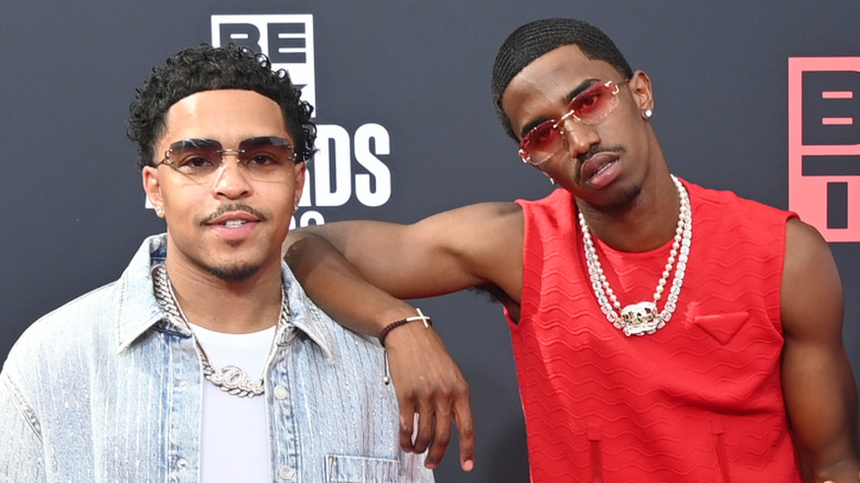 Justin and Christian Combs posing on step-and-repeat