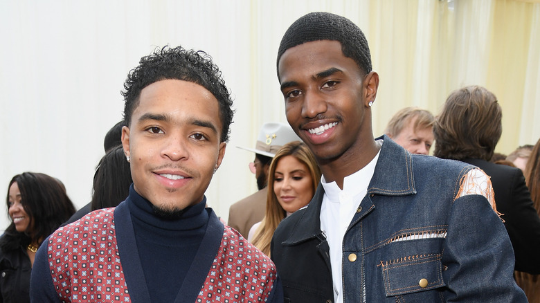 Justin and Christian Combs smiling at event