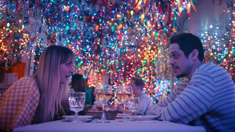 Pete Davidson and Kaley Cuoco talking at dinner