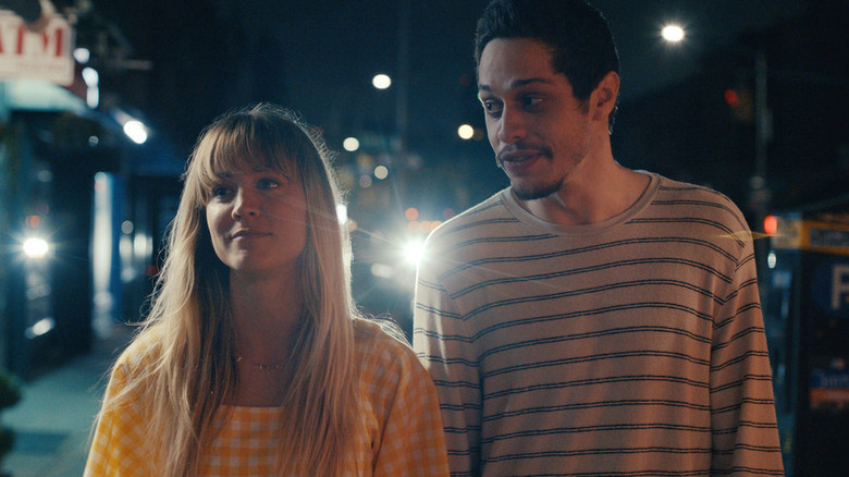 Pete Davidson and Kaley Cuoco walking at night