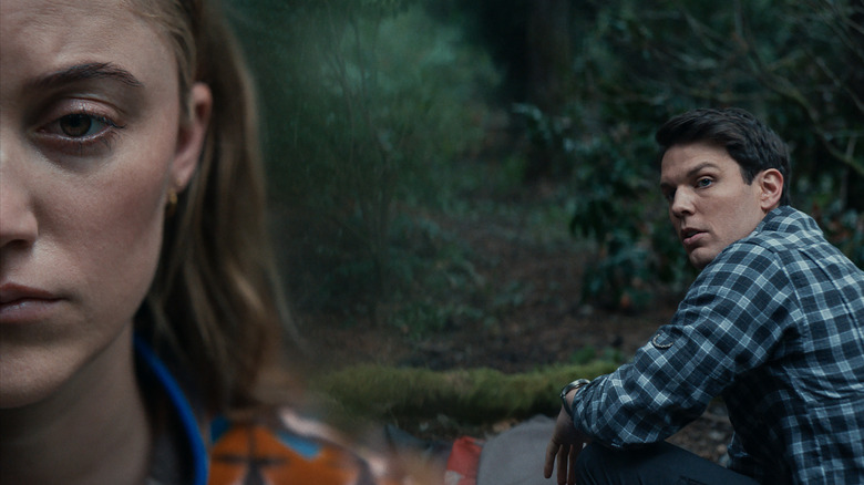 Maika Monroe and Jake Lacy in the woods in Significant Other