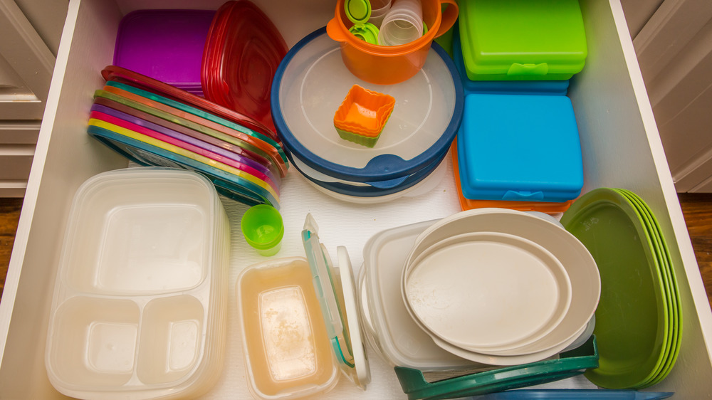 Stacked plastic containers and lids