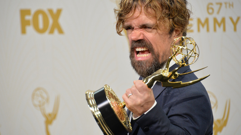 Peter Dinklage yelling with his award