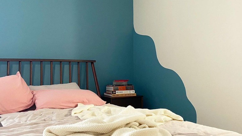 A bedroom with blue wave