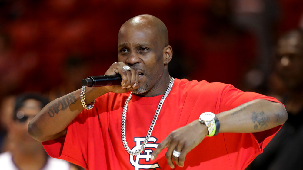 DMX performing in red shirt