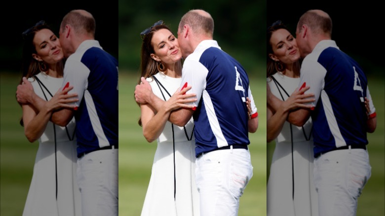 Prince William and Kate Middleton hug, kiss cheeks