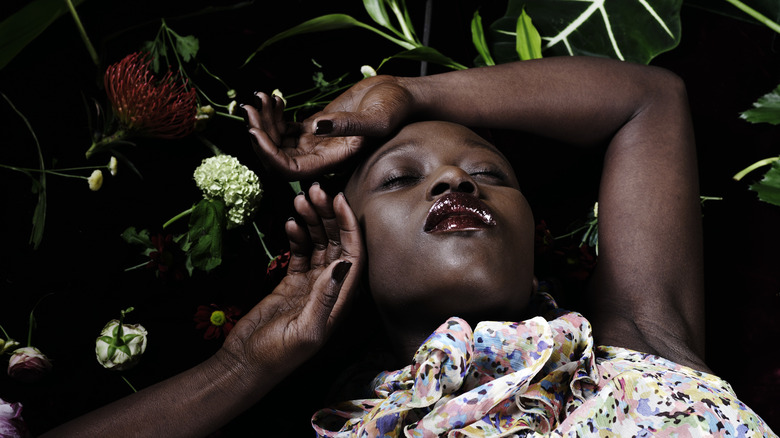 Woman sleeps peacefully in foliage