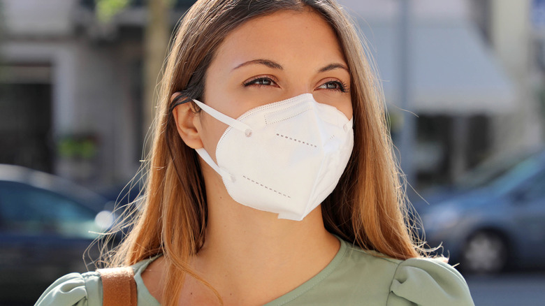 Woman wearing mask outside