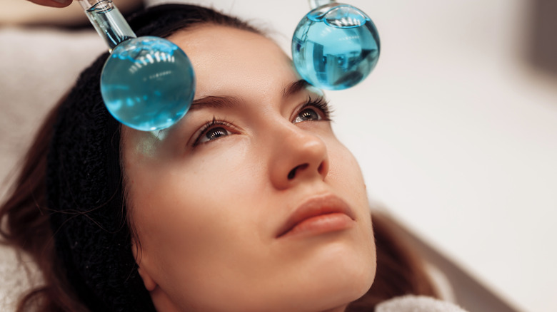 Woman using facial globes