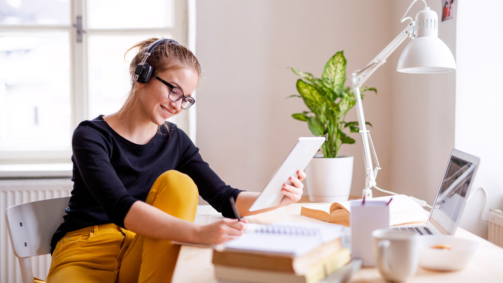 Smiling woman with earphones