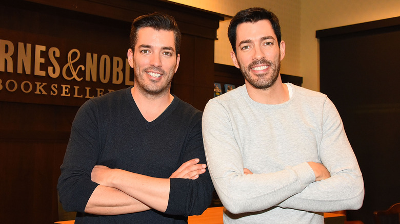 Jonathan and Drew Scott posing together at Barns & Noble event