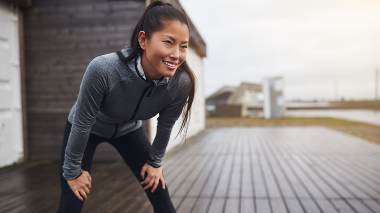 woman outside exercising on cloudy day