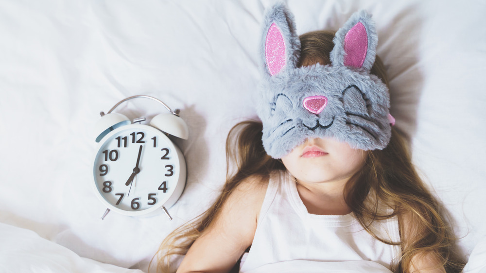 Kid with rabbit sleep mask