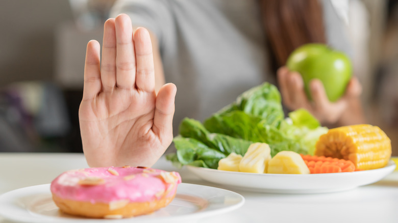 Woman refusing dessert