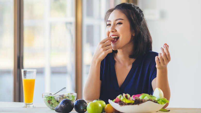 A woman eating fruits