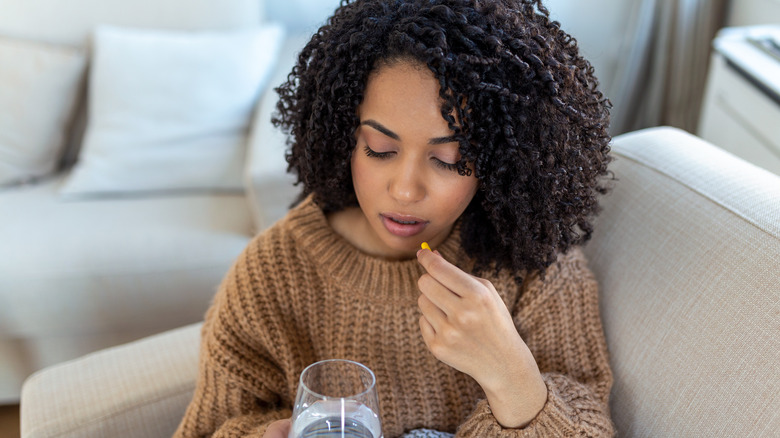 Woman taking pill