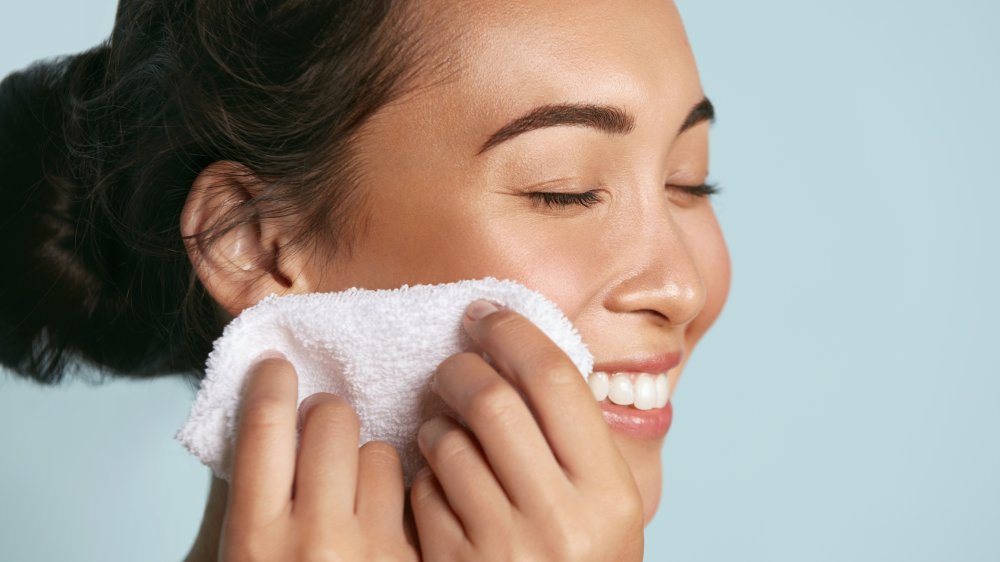 woman washing face