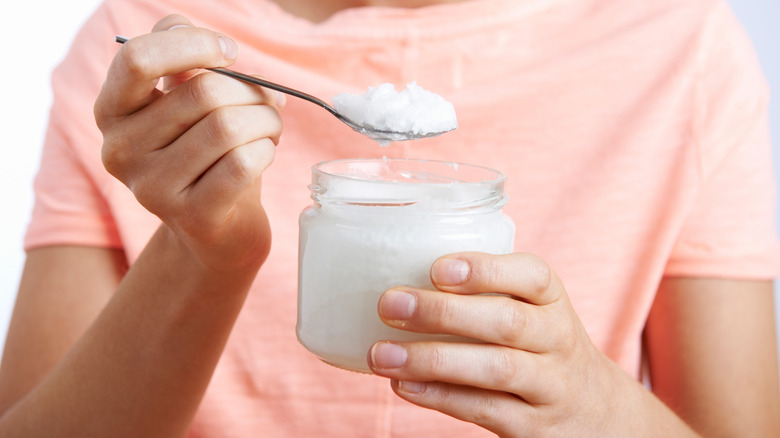 Woman with coconut oil 