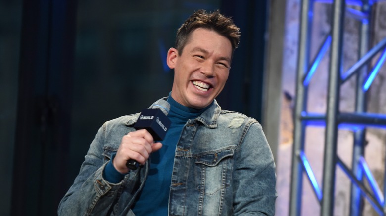 David Bromstad smiling with microphone