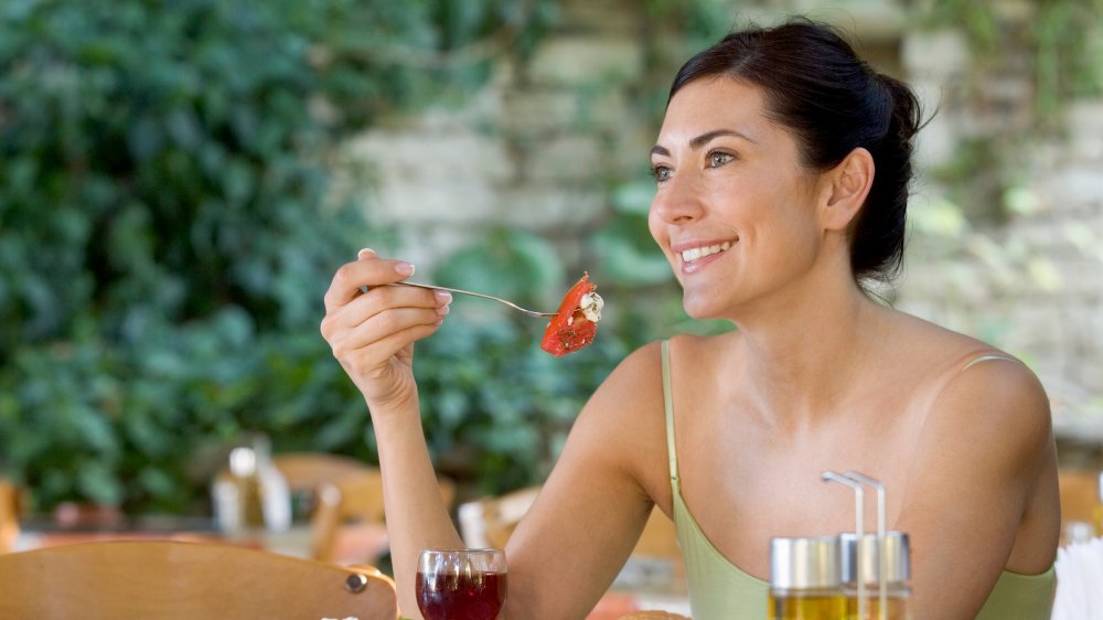 Woman eating happily