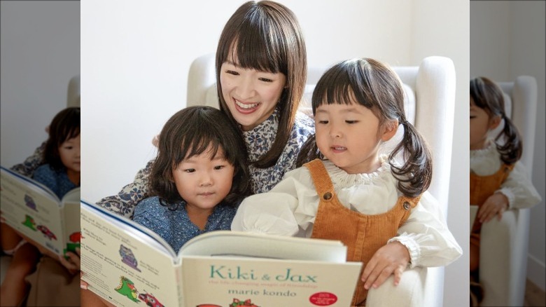 Kondo and daughters reading their new book