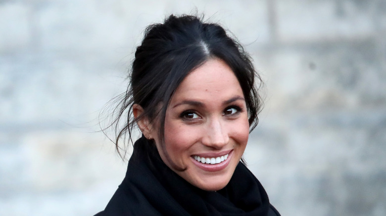 Meghan Markle smiles at an event.