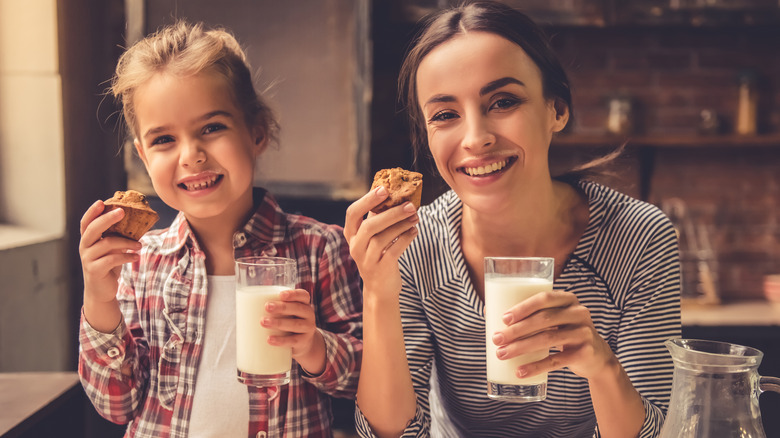 Mother and daughter drinking milk