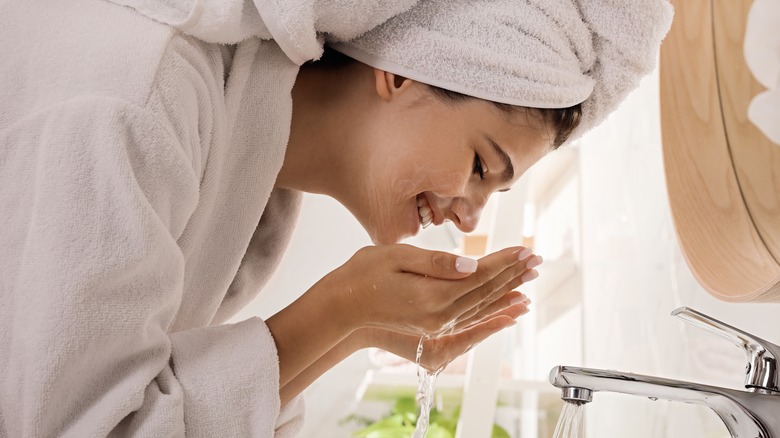 Girl washing face